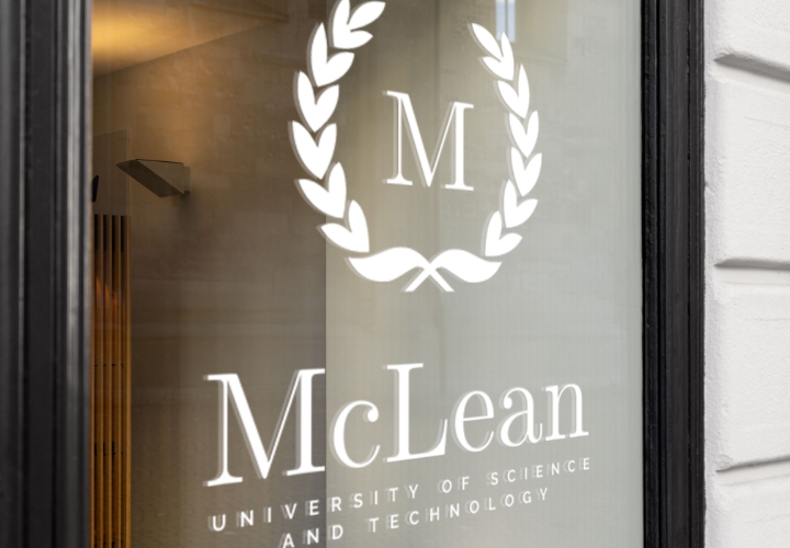 White decal of a university logo on a window